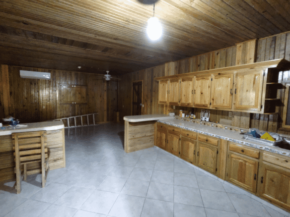 Terreno de venta en Omoa Cortes con naciente de agua y cabañas